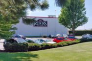 A photo of a large building with the logo for Reser's on it.