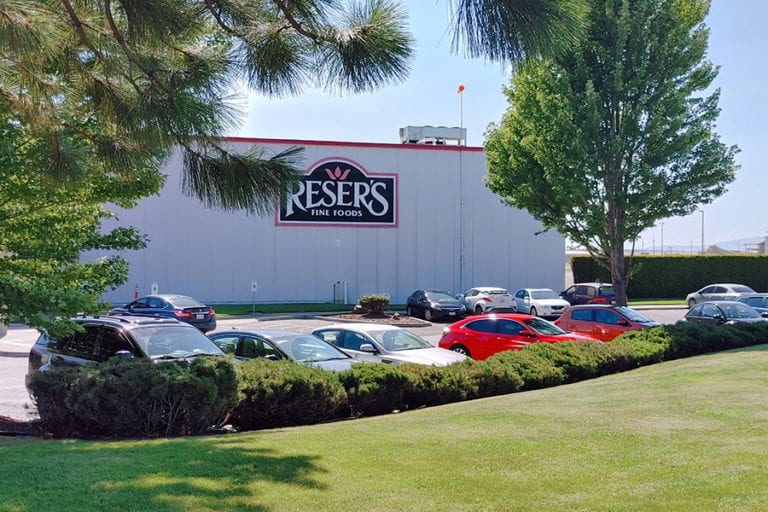 A photo of a large building with the logo for Reser's on it.