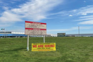 Hiring sign outside of Pasco Processing Center