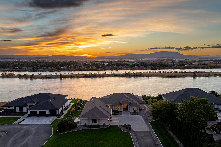 View of the home with a sunset in the background.